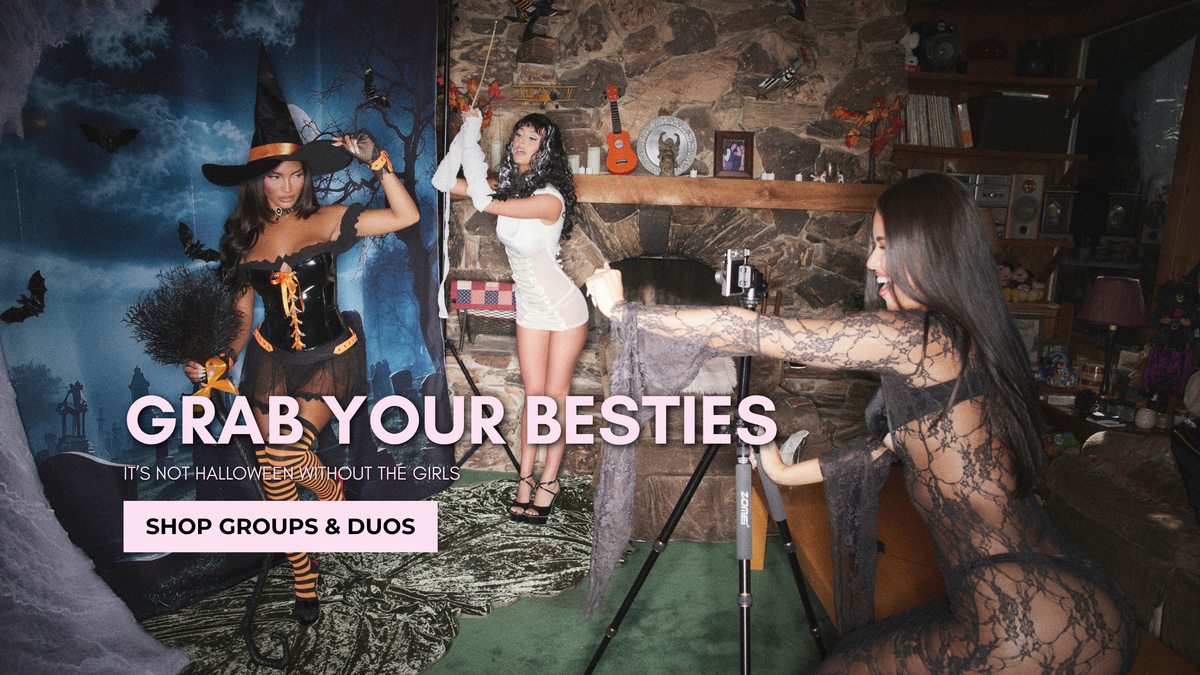 Grab Your besties, its not Halloween without the girls. shop group & duos. Morticia Addams, Y2K Witch, and the Bride of Frankenstein behind a cemetery backdrop in a cabin looking house having a photoshoot